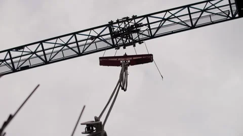 Tower crane lifting equipment at construction site Stock Footage 316697684