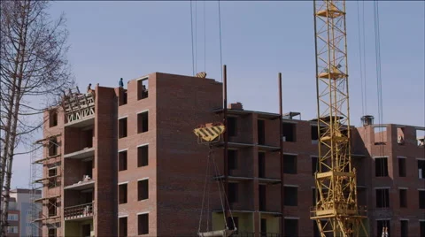 Tower crane lifts the load at a construction site Stock Footage 40541498