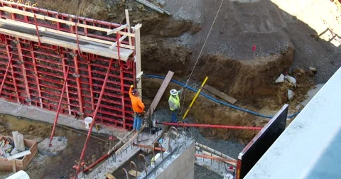 Tower Crane moves Material into Place - 4k Stock Footage 56259723