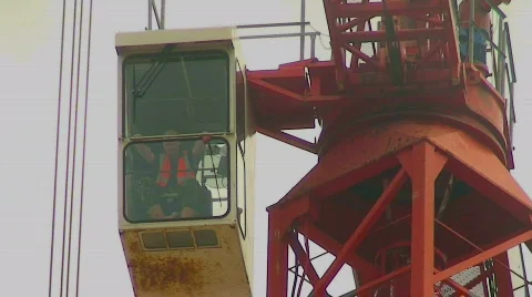 Tower crane operator sitting in cab Stock Footage 316836