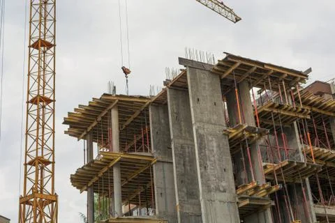 The tower crane over building. Stock Photos