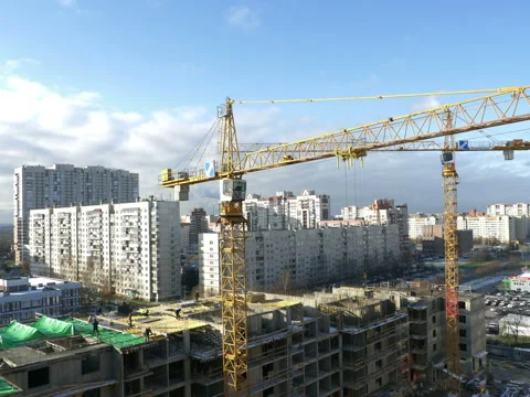 Tower crane over a construction site time lapse Stock Footage 119589843