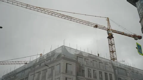 Tower crane in the process of building a luxury house in the city center. 스톡 동영상 320898330