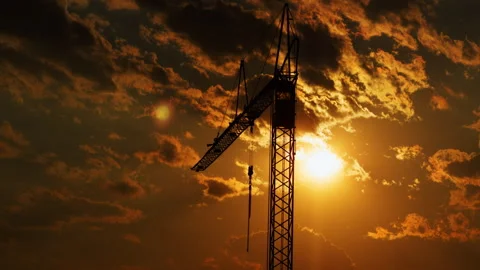 Tower Crane Silhouette Against Dramatic Sunset Sky at Construction Site Stock Footage 340190464
