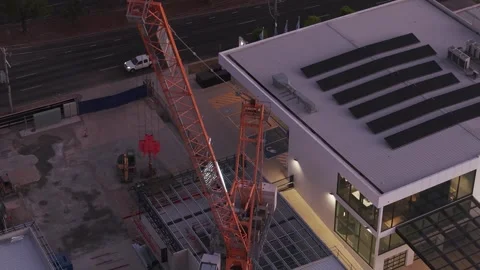 Tower crane working at building construction site at dusk Video stock 328131961
