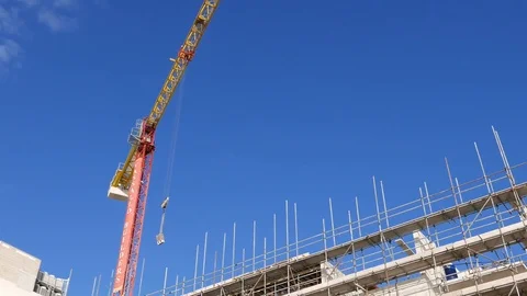 Tower crane working on a building site in Sliema, Malta Stock Footage 83310381
