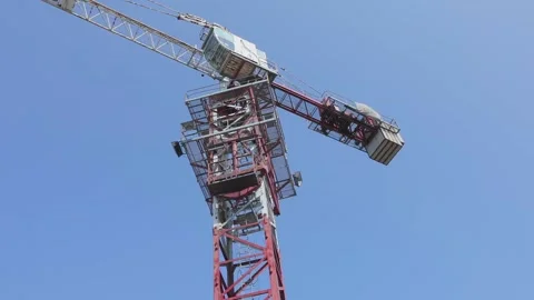 Tower crane working on a construction site. Construction crane. Tower crane at a Stock Footage 203885246