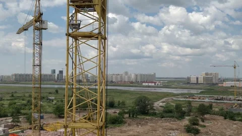 Tower crane working at construction site Stock Footage 247895577