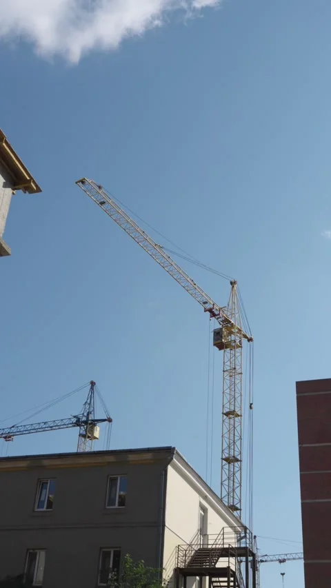Tower crane working at construction site Stock Footage 326794316