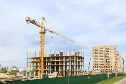 Tower crane working on a construction site Stock Photos