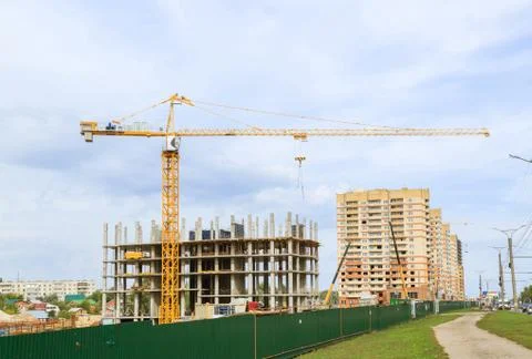 Tower crane working on a construction site Stock Photos