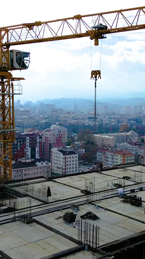 Tower Crane Working Multistory Construction Site Vertical Video Stock Footage 334874816