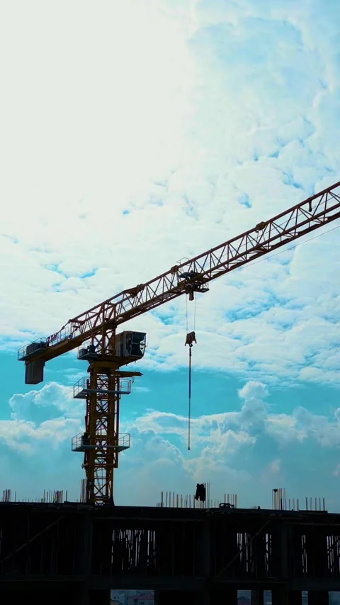 Tower Crane Working Multistory Construction Site Vertical Video Stock-Footage 334880334