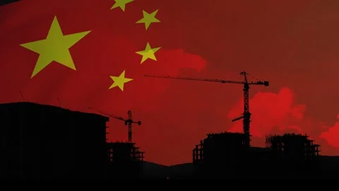 Tower cranes and buildings under construction against the sky painted in red by Stock Footage 301756828