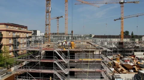 Tower cranes are working on the construction of residential building Stock Footage 40731955