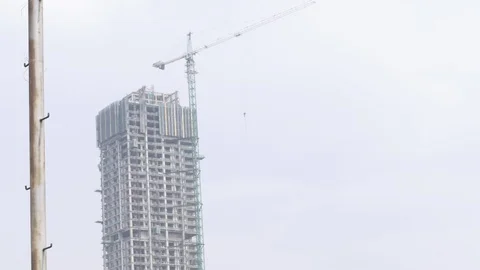 Tower cranes are working in support of the building development cycle Video stock 119617737