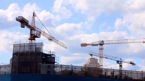 Tower cranes building a house Stock Footage 52085542