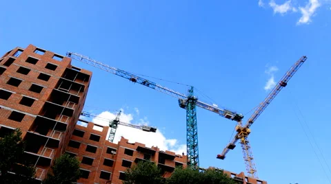 Tower cranes building a house Stock Footage 52567554