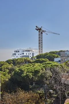 Tower cranes construct house in the Carmel area of Haifa Stock Photos
