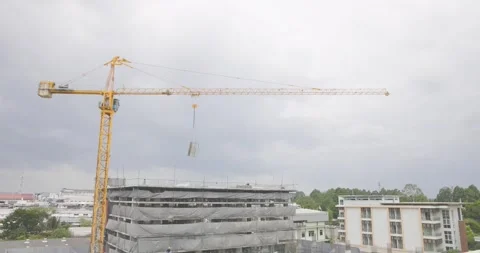 Tower cranes on the construction site, against sky is cloudy and it is abou.. Stock Footage 303039260