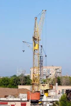 Tower cranes on the construction site Stock Photos