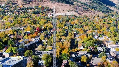 Tower Cranes | Fall Colors | Construction | CU Campus | Boulder Colorado | Drone Stock Footage 293244003