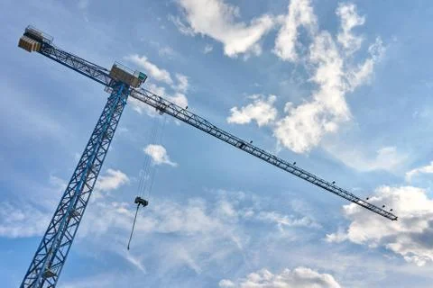 Tower cranes for lifting loads in the construction of tall buildings. Stock-Fotos