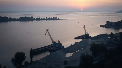 Tower cranes load sand onto barges Stock Footage 98372811