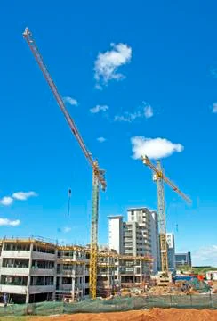 Tower cranes operating on construction site in umhlanga durban south africa Stock Photos