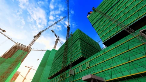 Tower cranes operating on urban construction sites Stock Footage 325757038