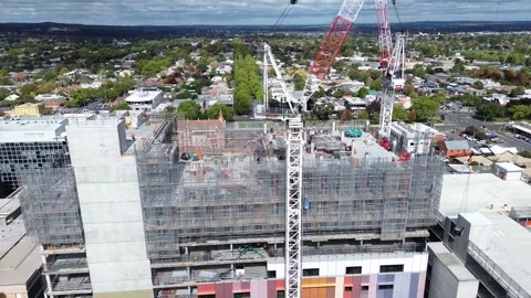 Tower cranes over a multi-storey building construction site Stock Footage 332786723