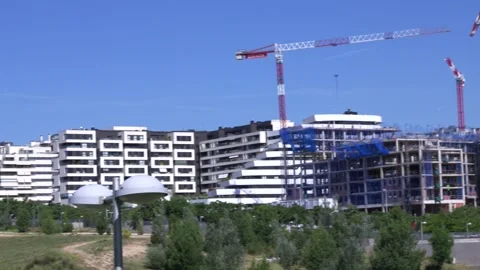 Tower cranes over residential construction site Video stock 335484942