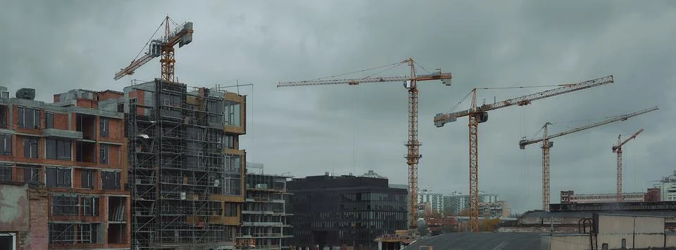 Tower cranes on the sky background web banner Stock Photos