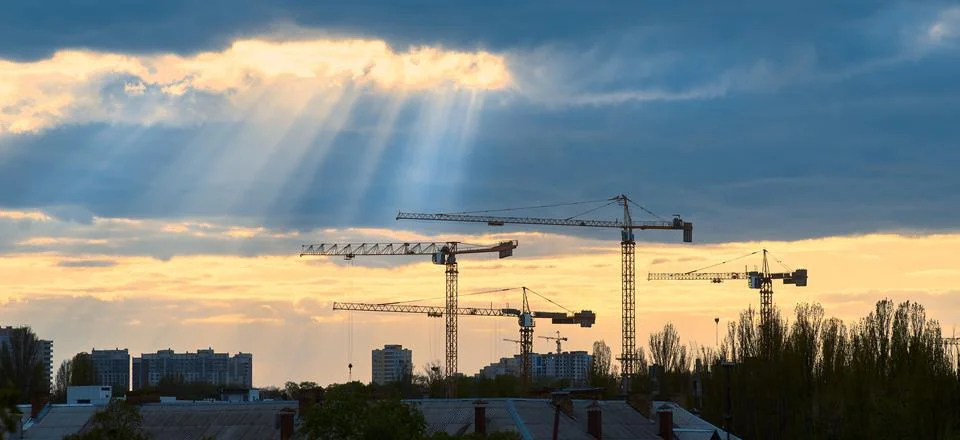Tower cranes on the sky background web banner Stock Photos