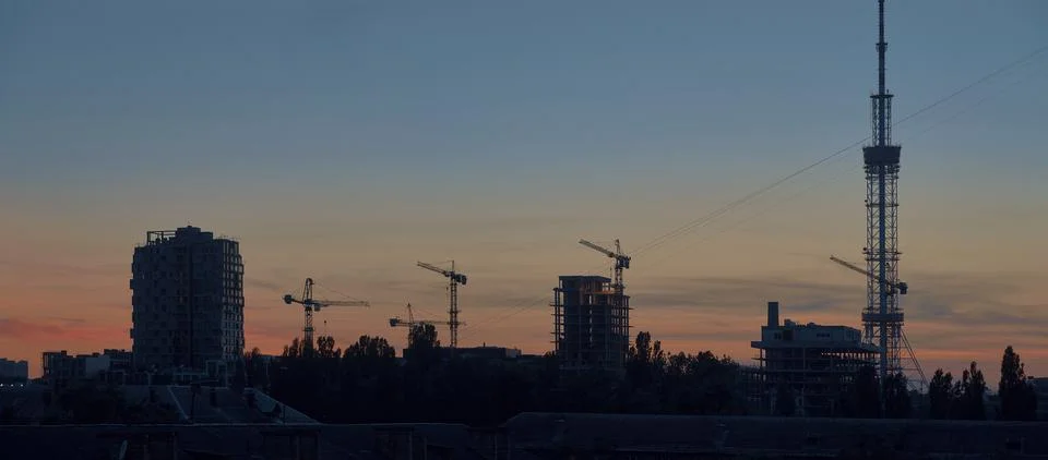 Tower cranes on the sky background web banner Stock Photos