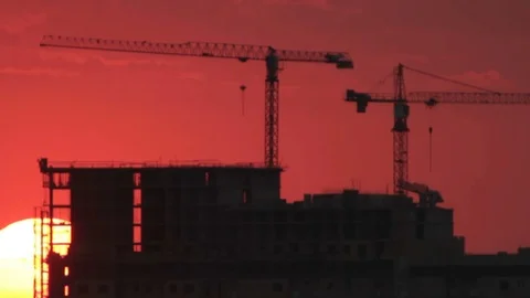 Tower cranes in sunrise Stock Footage 84727340