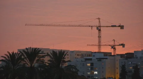 Tower cranes sunset Stock Footage 58606407