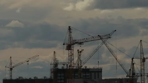 Tower cranes work on the construction of a high-rise building, time-lapse video. Stock Footage 133622728