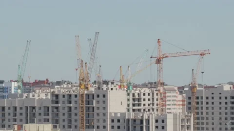 Tower cranes work on the construction of a high-rise building, time-lapse video. Stock Footage 133622748