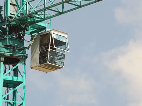 Tower cranes work during the construction of a multi-story building. New apar Stock Photos