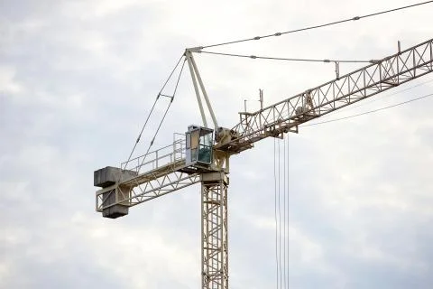 Tower cranes work during the construction of a multi-story building. New apar Stock Photos