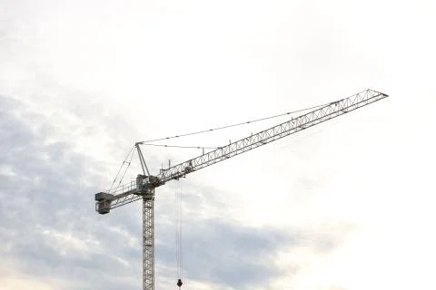 Tower cranes work during the construction of a multi-story building. New apar Stock Photos