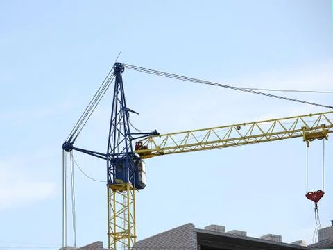 Tower cranes work during the construction of a multi-story building. New apar Stock Photos