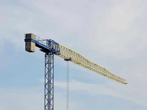 Tower cranes work during the construction of a multi-story building. New apar Stock Photos