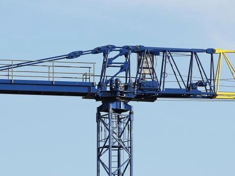 Tower cranes work during the construction of a multi-story building. New apar Stock Photos