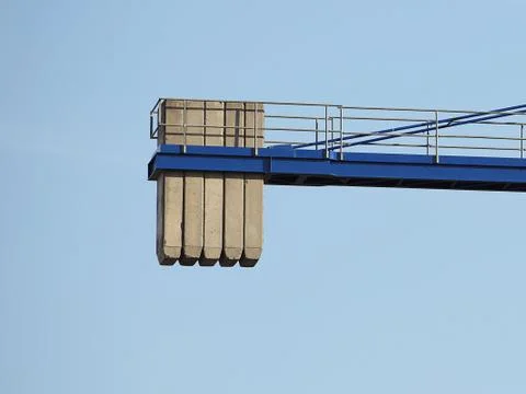 Tower cranes work during the construction of a multi-story building. New apar Stock Photos