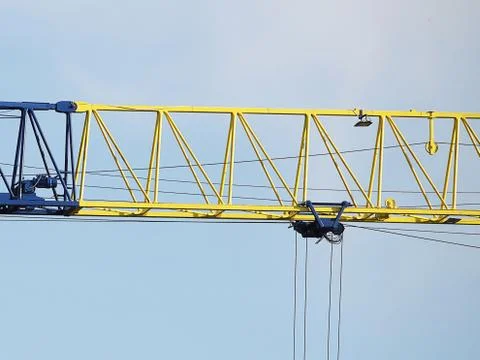 Tower cranes work during the construction of a multi-story building. New apar Stock Photos