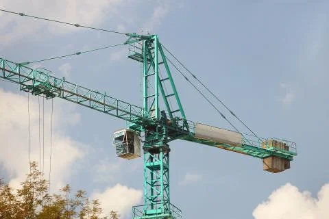 Tower cranes work during the construction of a multi-story building. New apar Stock Photos