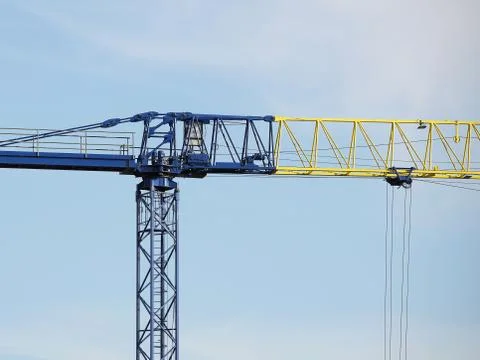 Tower cranes work during the construction of a multi-story building. New apar Stock Photos