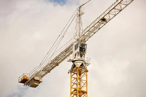 Tower cranes work during the construction of a multi-story building. New ap.. Stock Photos